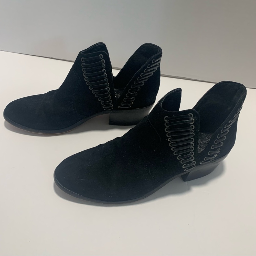 Vince Camuto ankle booties with eyelets and laces up sides.